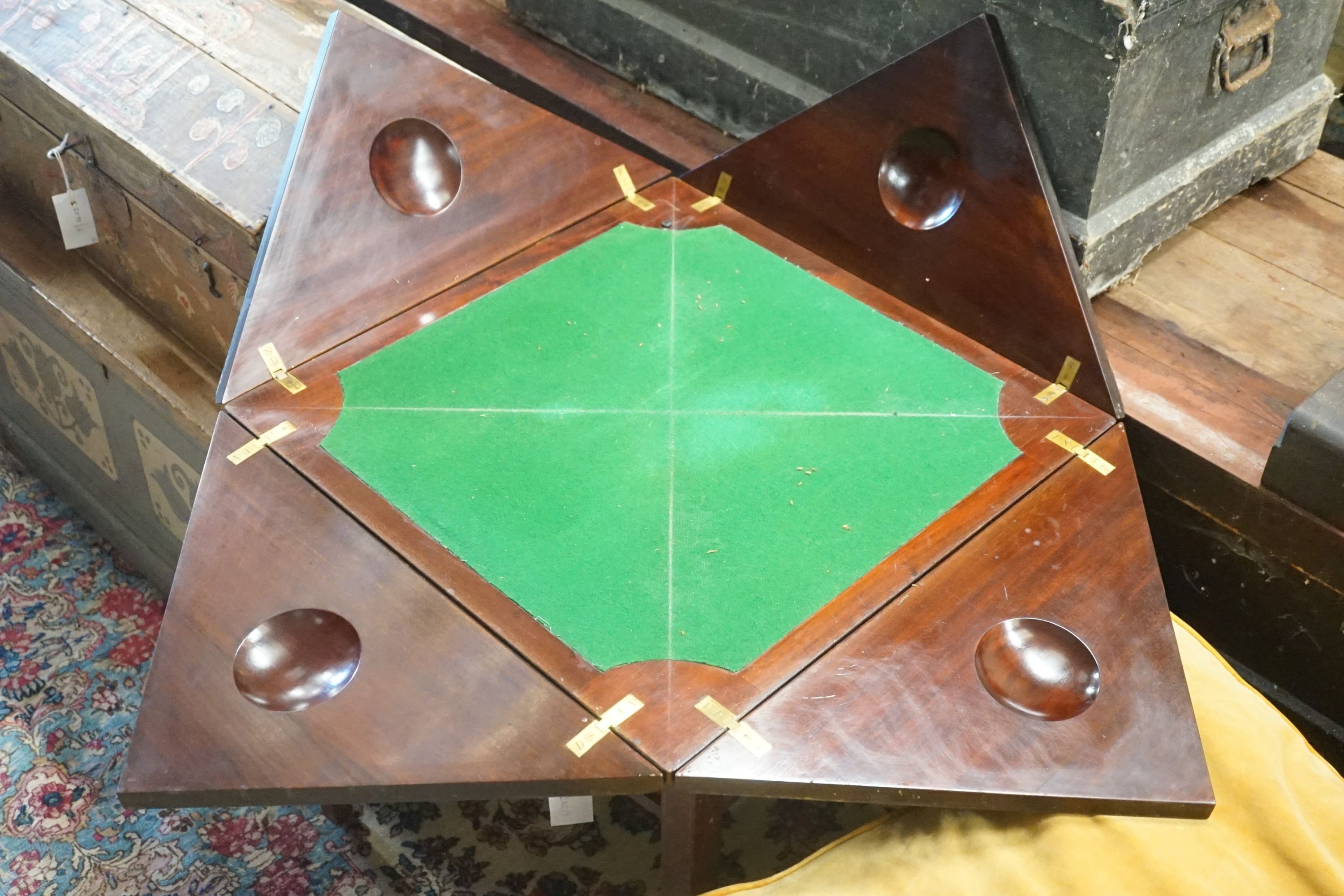 An Edwardian mahogany envelope card table, (cut down), width 56cm, depth 56cm, height 60cm